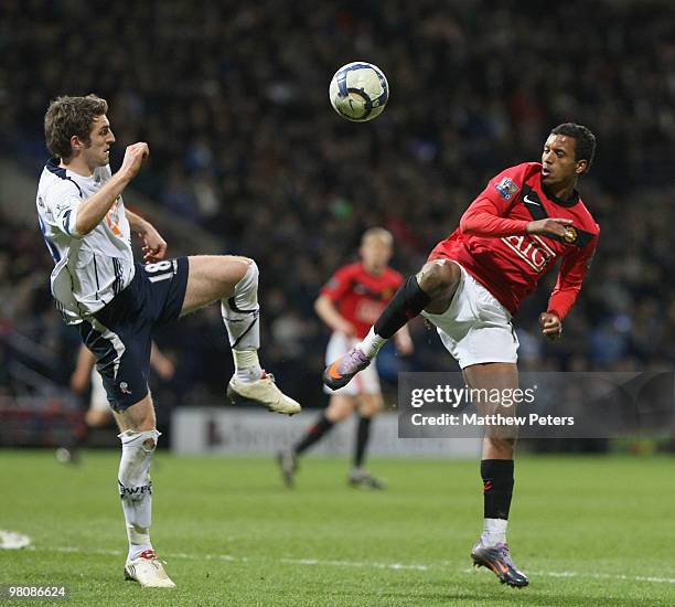 Nani of Manchester United clashes with Samuel Ricketts of Bolton Wanderers during the FA Barclays Premier League match between Bolton Wanderers and...