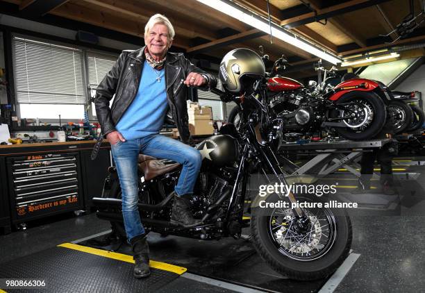 March 2018, Germany, Tuttlingen: Singer Matthias Reim presents his new Harley Davidson. His new album 'Meteor' is released on 23 March. Photo:...