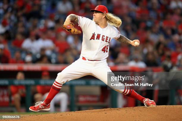 John Lamb of the Los Angeles Angels of Anaheim pitches during the second inning of a game against the Toronto Blue Jays at Angel Stadium on June 21,...