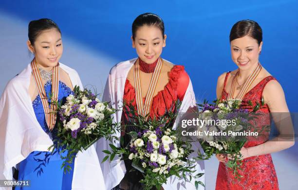 Yu-Na Kim of Korea, Mao Asada of Japan and Laura Lepisto of Finland pose with their medals after the Ladies Free Skate during the 2010 ISU World...