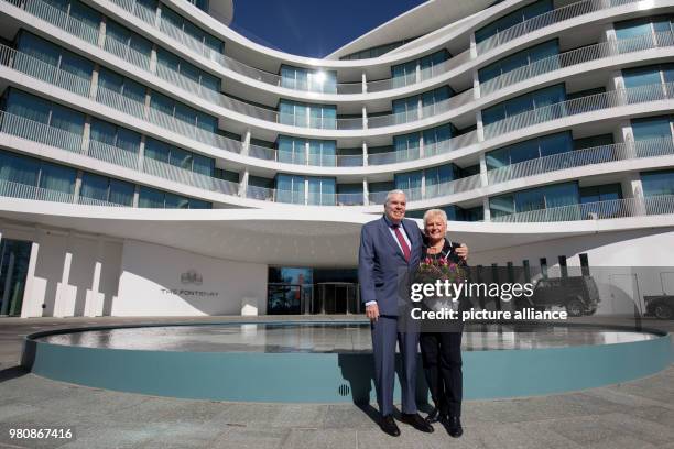 March 2018, Germany, Hamburg: Logistics billionaire and Hamburger SV investor Klaus Michael Kuehne and his wife Christine stand outside 'The...