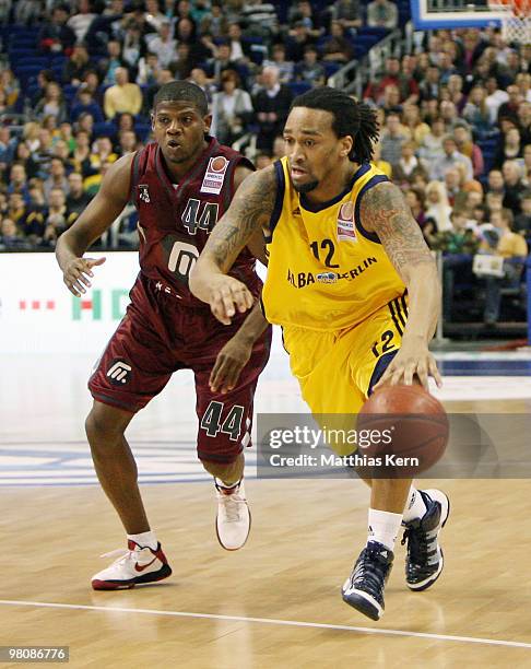 Rashad Wright of Berlinmoves against Hollis Price of Quakenbrueck during the Beko Basketball Bundesliga match between Alba Berlin and Artland Dragons...