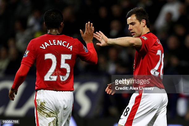 Darron Gibson of Manchester United is congratulated by team mate Antonio Valencia after scoring his team's fourth goal during the Barclays Premier...