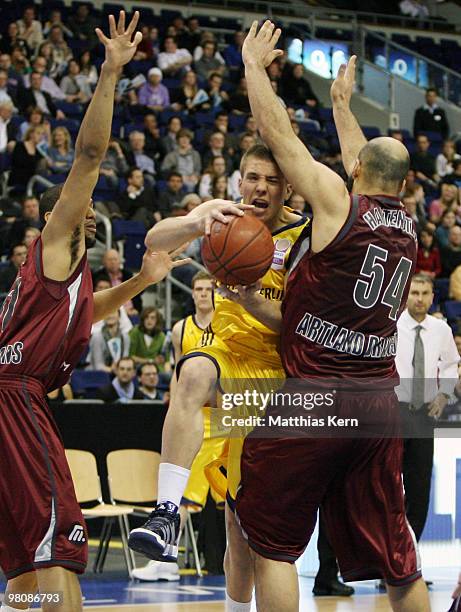 Steffen Hamann of Berlin is attacked by Charles Lee of Quakenbrueck and team mate Florian Hartenstein during the Beko Basketball Bundesliga match...
