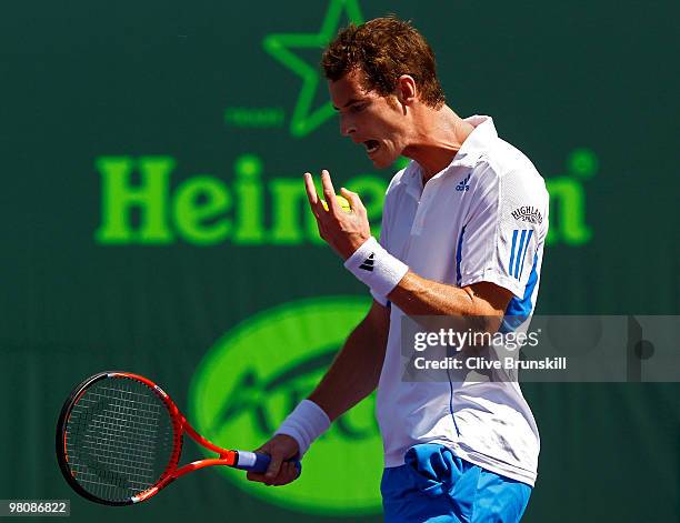 Andy Murray of Great Britain reacts after losing a game against Mardy Fish of the United States during day five of the 2010 Sony Ericsson Open at...