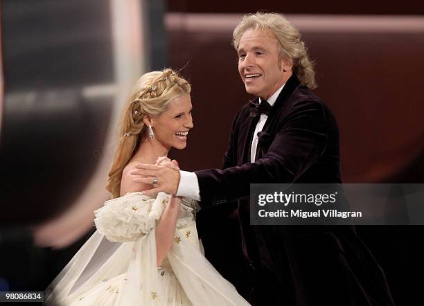 Hosts Michelle Hunziker and Thomas Gottschalk dance a walse during the 188th 'Wetten dass ...?' show at Messezentrum Salzburg on March 27, 2010 in...