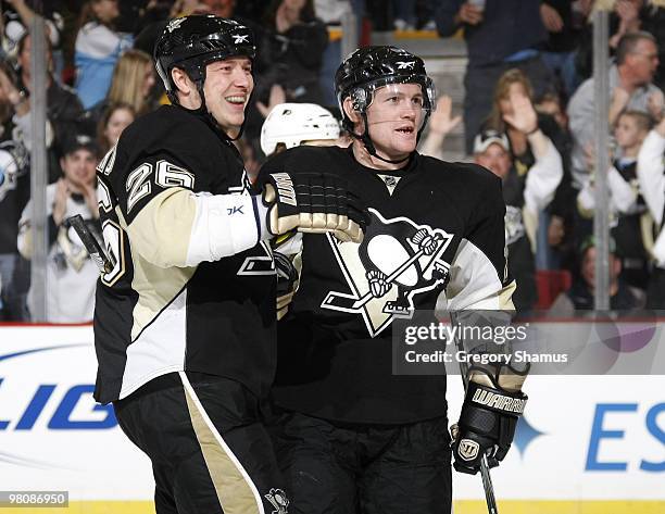 Matt Cooke of the Pittsburgh Penguins celebrates his goal with Ruslan Fedotenko against the Philadelphia Flyers on March 27, 2010 at Mellon Arena in...