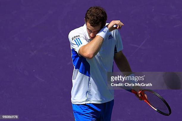 Andy Murray of Great Britain wipes his face while playing against Mardy Fish of the United States during day five of the 2010 Sony Ericsson Open at...