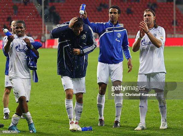 Jefferson Farfan, Kevin Kuranyi, Joel Matip and Marcelo Bordon of Schalke celebrate the 2:0 victory after the Bundesliga match between Bayer...