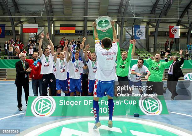 Players of SD Croatia Berlin celebrate after winning the final of the DFB futsal cup at the Lausitz-Arena on March 27, 2010 in Cottbus, Germany.
