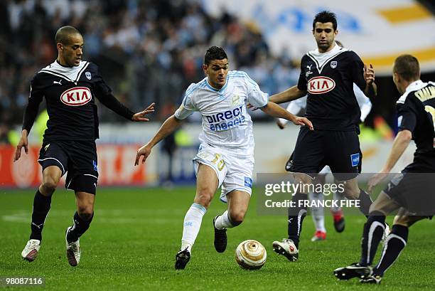 Marseille's forward Hatem Ben Arfa vies with Bordeaux's opponents during the League Cup final match Marseille vs. Bordeaux on March 27, 2010 at the...