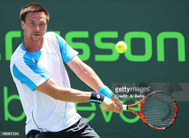 Robin Soderling of Sweden returns a shot against Peter Luczak of Australia during day five of the 2010 Sony Ericsson Open at Crandon Park Tennis...