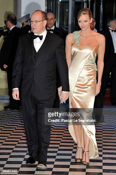 Prince Albert II of Monaco and Charlene Wittstock arrive to attend the Monte Carlo Morocco Rose Ball 2010 held at the Sporting Monte Carlo on March...