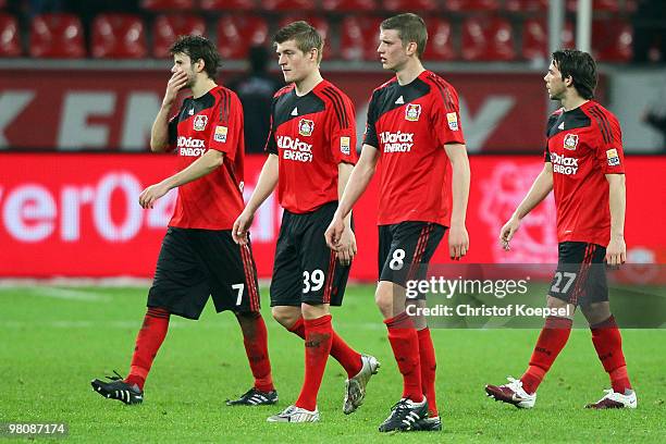 Tranquillo Barnetta, Toni Kroos, Lars Bender and Gonzalo Castro of Leverkusen look dejected after losing 0-2 the Bundesliga match between Bayer...