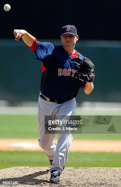 Pitcher John Lackey of the Boston Red Sox pitches against the Baltimore Orioles during a Grapefruit League Spring Training Game at Ed Smith Stadium...