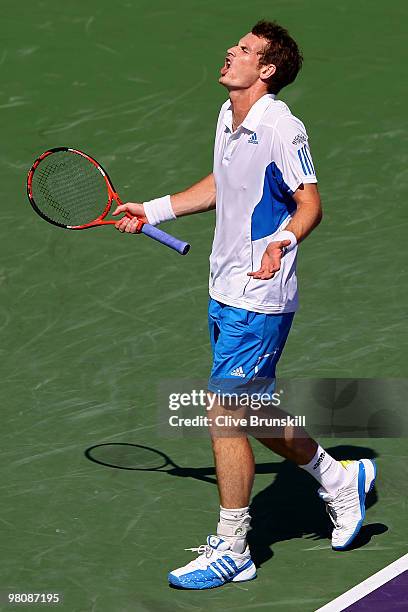 Andy Murray of Great Britain reacts after a shot against Mardy Fish of the United States during day five of the 2010 Sony Ericsson Open at Crandon...