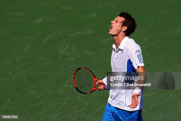 Andy Murray of Great Britain reacts after a shot against Mardy Fish of the United States during day five of the 2010 Sony Ericsson Open at Crandon...