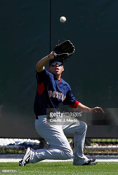 Outfielder Jacoby Ellsbury of the Boston Red Sox catches a fly ball against the Baltimore Orioles during a Grapefruit League Spring Training Game at...