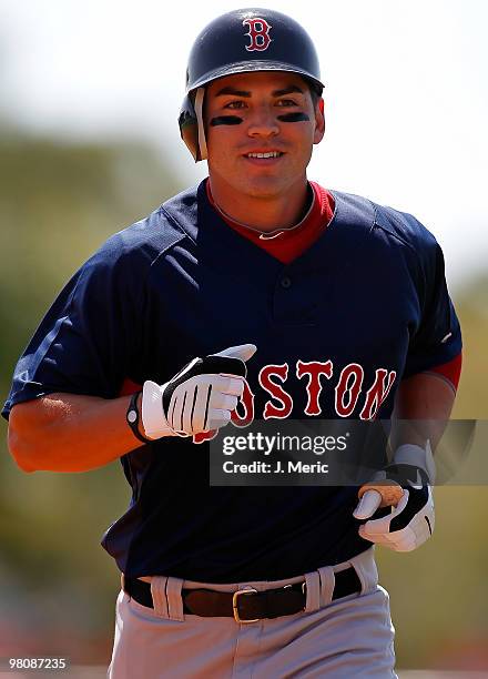 Outfielder Jacoby Ellsbury of the Boston Red Sox jogs back to the dugout after the inning against the Baltimore Orioles during a Grapefruit League...