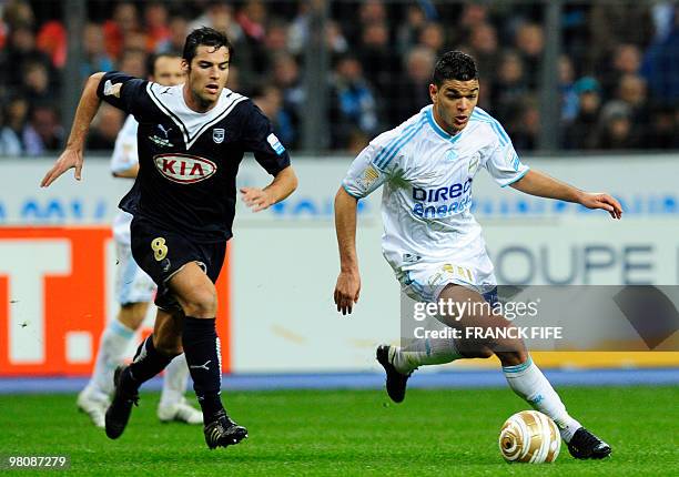 Bordeaux' midfielder Yoann Gourcuff vies with Marseille's forward Hatem Ben Arfa during the League Cup final match Marseille vs. Bordeaux on March...