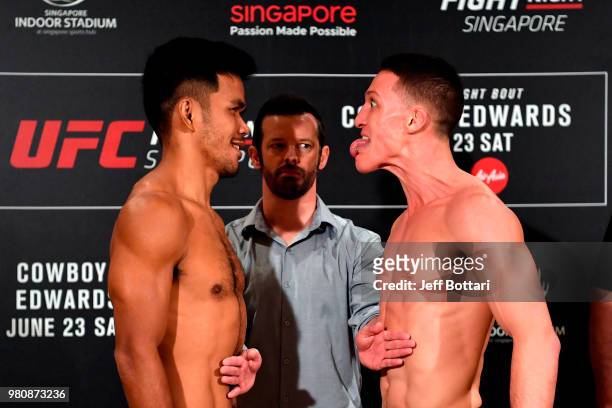 Opponents Rolando Dy of Phillippines and Shane Young of New Zealand face off during the UFC Fight Night weigh-in at the Mandarin Oriental on June 22,...