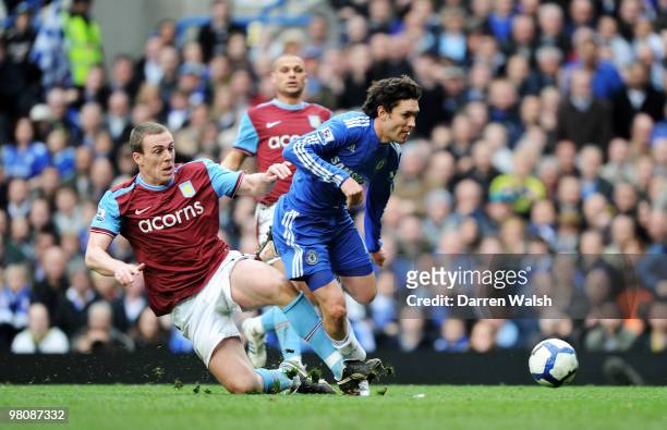 Richard Dunne of Aston Villa challenges Yury Zhirkov of Chelsea resulting in a penalty during the Barclays Premier League match between Chelsea and...