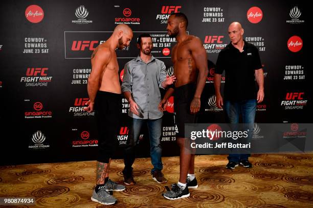 Opponents Donald Cerrone of the United States and Leon Edwards of Jamaica face off during the UFC Fight Night weigh-in at the Mandarin Oriental on...