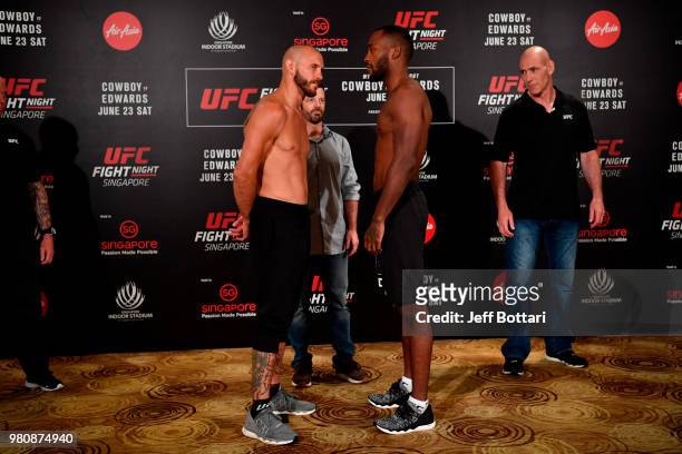 Opponents Donald Cerrone of the United States and Leon Edwards of Jamaica face off during the UFC Fight Night weigh-in at the Mandarin Oriental on...