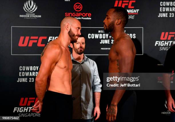 Opponents Donald Cerrone of the United States and Leon Edwards of Jamaica face off during the UFC Fight Night weigh-in at the Mandarin Oriental on...