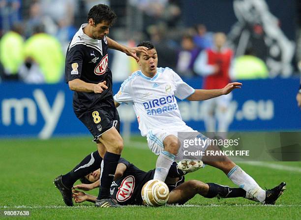 Marseille's forward Hatem Ben Arfa vies with Bordeaux' midfielder Yoann Gourcuff during the League Cup final match Marseille vs. Bordeaux on March...