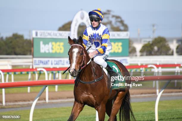 Brad Rawiller returns to the mounting yard on Mussoorie Magic after winning the Community Sector Banking Maiden Plate, at Geelong Racecourse on June...