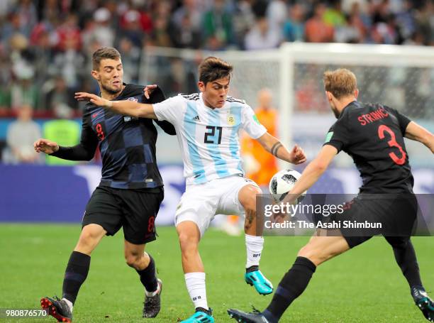 Paulo Dybala of Argentina controls the ball under pressure of Andrej Kramaric and Ivan Strinic of Croatia during the 2018 FIFA World Cup Russia Group...