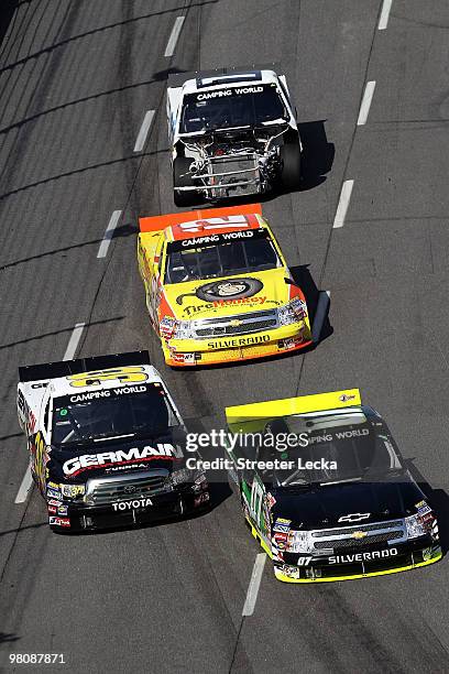 Tony Jackson Jr., driver of the ASI Limited Chevrolet, leads a group of trucks during the NASCAR Camping World Truck Series Kroger 250 at...