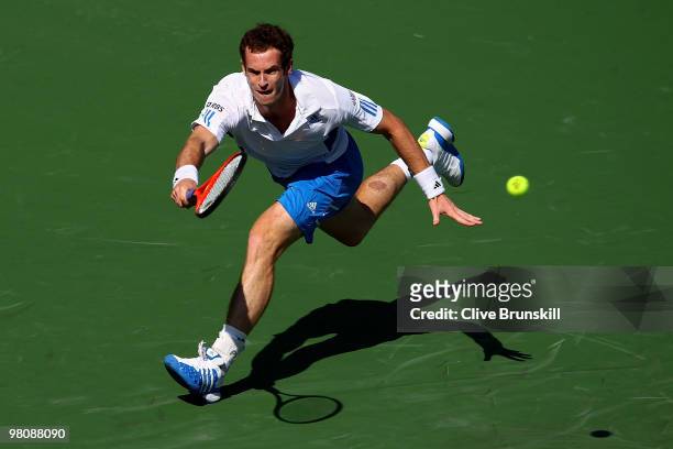 Andy Murray of Great Britain returns a shot against Mardy Fish of the United States during day five of the 2010 Sony Ericsson Open at Crandon Park...
