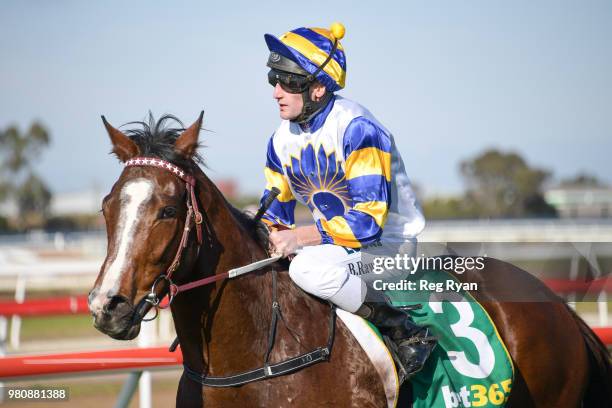 Brad Rawiller returns to the mounting yard on Mussoorie Magic after winning the Community Sector Banking Maiden Plate, at Geelong Racecourse on June...