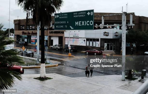 People walk towards the border between Mexico and the United States on June 21, 2018 in Reynosa, Mexico. Immigration has once again been put in the...