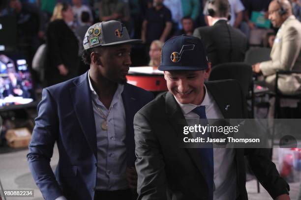 Grayson Allen talks with Donovan Mitchell after being selected twenty-first overall by the Utah Jazz during the 2018 NBA Draft on June 21, 2018 at...