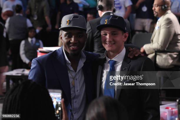 Grayson Allen talks with Donovan Mitchell after being selected twenty-first overall by the Utah Jazz during the 2018 NBA Draft on June 21, 2018 at...