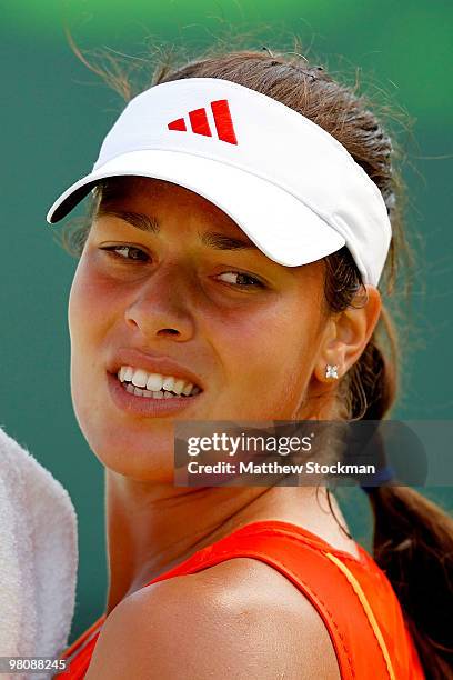 Ana Ivanovic of Serbia wipes her face while playing against Agnieszka Radwanska of Poland during day five of the 2010 Sony Ericsson Open at Crandon...
