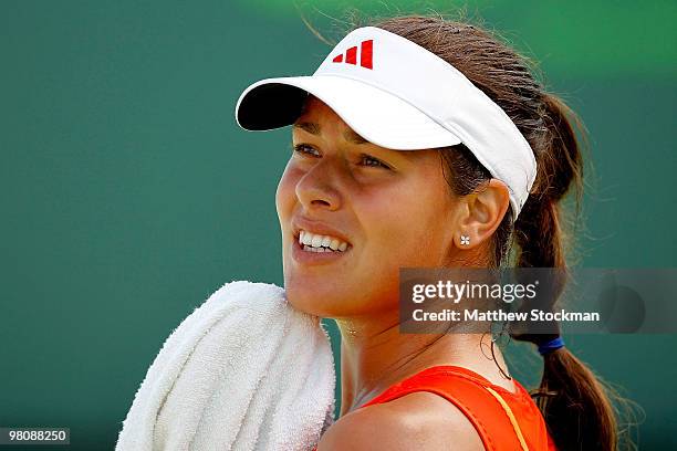 Ana Ivanovic of Serbia wipes her face while playing against Agnieszka Radwanska of Poland during day five of the 2010 Sony Ericsson Open at Crandon...