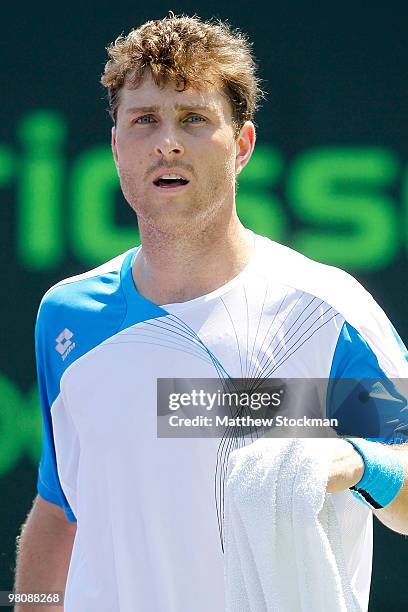 Michael Berrer of Germany wipes his face while playing against Feliciano Lopez of Spain during day five of the 2010 Sony Ericsson Open at Crandon...