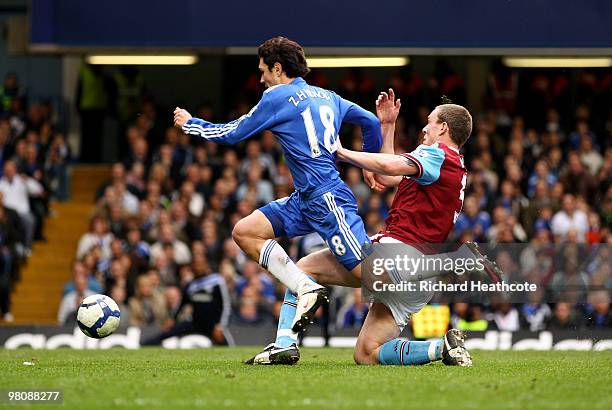 Richard Dunne of Aston Villa challenges Yury Zhirkov of Chelsea resulting in a penalty during the Barclays Premier League match between Chelsea and...