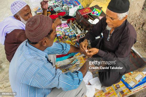 muslims gets attar perfume - david talukdar stock pictures, royalty-free photos & images