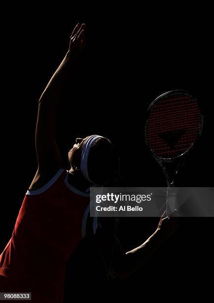Gisela Dulko of Argentina serves against Marion Bartoli of France during day five of the 2010 Sony Ericsson Open at Crandon Park Tennis Center on...