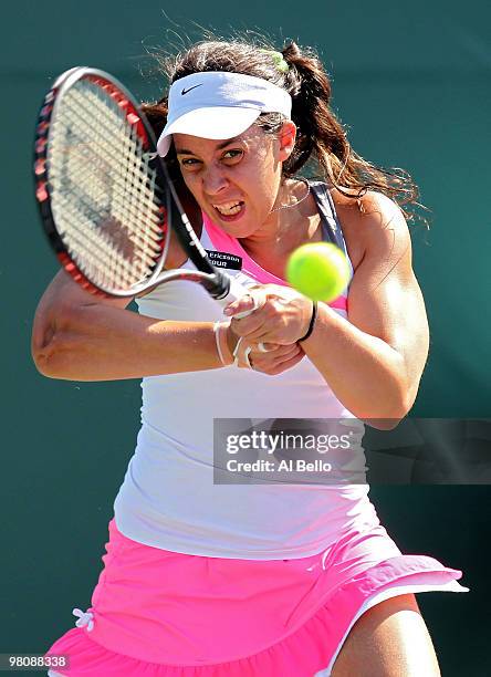 Marion Bartoli of France returns a shot against Gisela Dulko of Argentina during day five of the 2010 Sony Ericsson Open at Crandon Park Tennis...