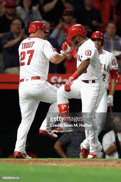 Mike Trout congratulates Luis Valbuena of the Los Angeles Angels of Anaheim on his two-run homerun during the fifth inning of a game against the...