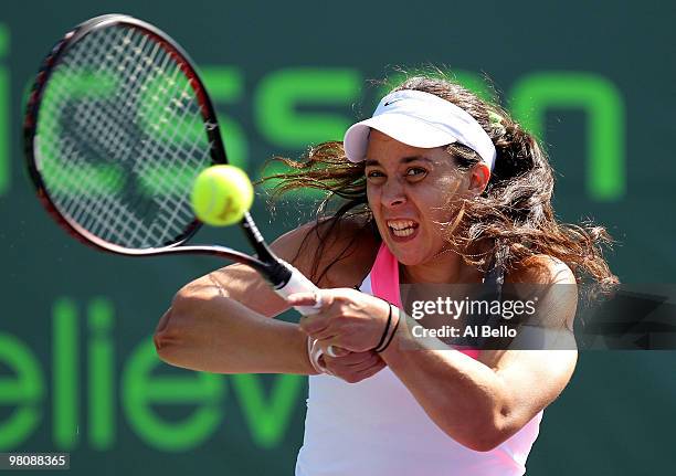 Marion Bartoli of France returns a shot against Gisela Dulko of Argentina during day five of the 2010 Sony Ericsson Open at Crandon Park Tennis...