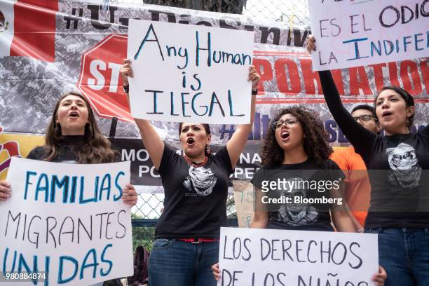 Protesters shout slogans and hold placards during a 'Families Belong Together' rally outside the U.S. Embassy in Mexico City, Mexico, on Thursday,...
