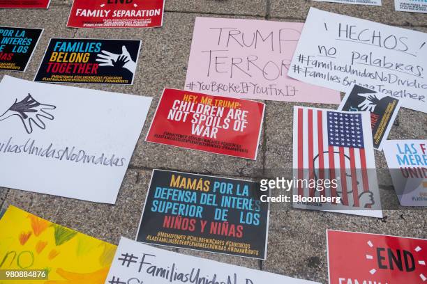 Placards are displayed on a sidewalk during a 'Families Belong Together' rally outside the U.S. Embassy in Mexico City, Mexico, on Thursday, June 21,...