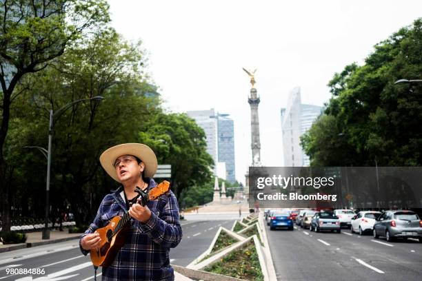 Protester performs during a 'Families Belong Together' rally outside the U.S. Embassy in Mexico City, Mexico, on Thursday, June 21, 2018. President...